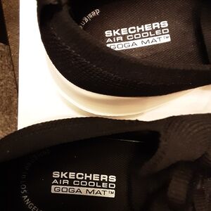 Skechers Black Slip-On Sneakers with White Sole